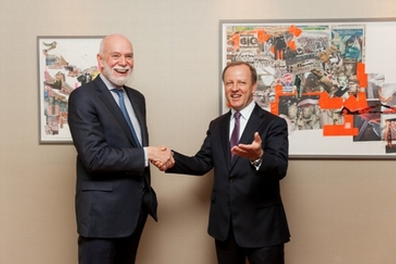 Stefan Krause (R), Deutsche Bank Management Board member, greets Richard Armstrong (L), Director of the Solomon R. Guggenheim Museum and Foundation.